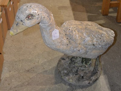 Lot 421 - A composite goose garden ornament standing on...