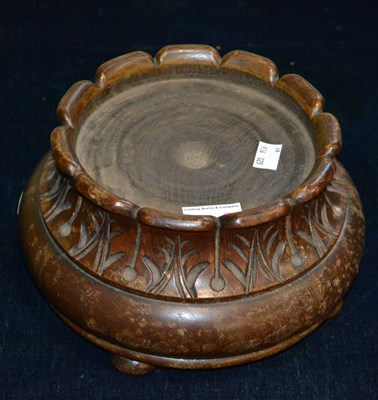 Lot 424 - A carved wood vase/ urn stand, raised on four...