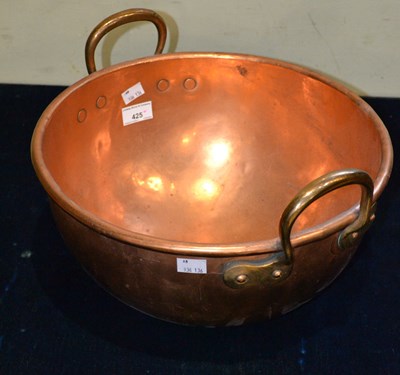 Lot 425 - A copper bowl/ water vessel with shaped looped...