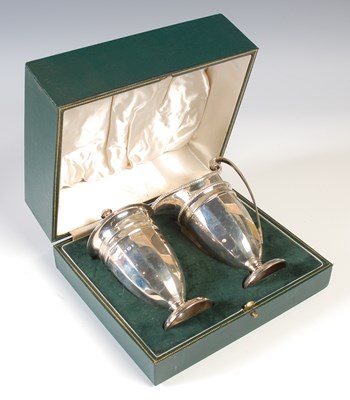 Lot 105 - A cased Sheffield silver cream jug and...
