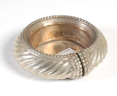 Lot 109 - An Eastern white metal bangle converted to a...