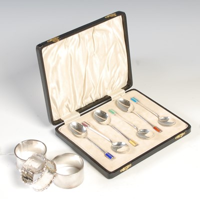 Lot 127 - Three assorted silver napkin rings; together...