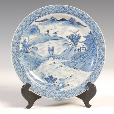 Lot 136 - A Chinese porcelain blue and white plate, Qing...