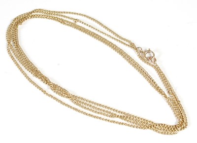 Lot 168 - A long yellow metal necklace, the ring clasp...