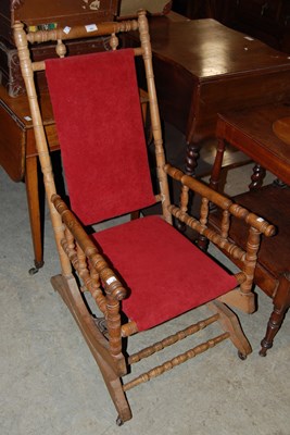 Lot 792 - A 20th century rocking chair with turned...