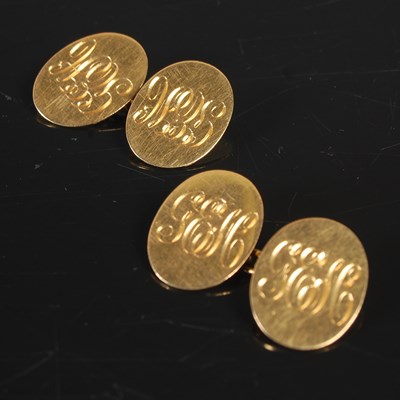 Lot 176 - A pair of 18ct gold cufflinks, the oval panels...