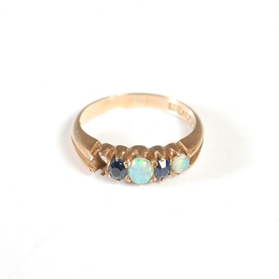 Lot 179 - A yellow metal opal and sapphire ring, set...
