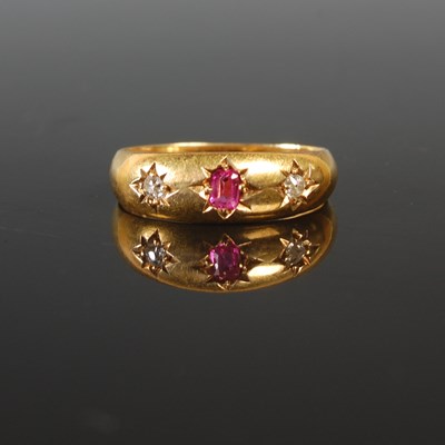 Lot 184 - An 18ct gold ruby and diamond three stone...