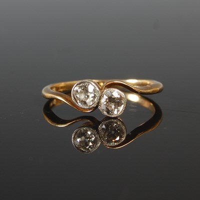 Lot 192 - A yellow and white metal two stone diamond...