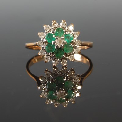 Lot 195 - A yellow metal emerald and diamond cluster...