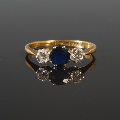 Lot 196 - A yellow and white metal three stone sapphire...