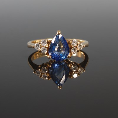 Lot 197 - A yellow metal sapphire and diamond set ring,...
