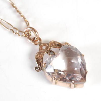 Lot 207 - A yellow metal necklace suspending a gold...