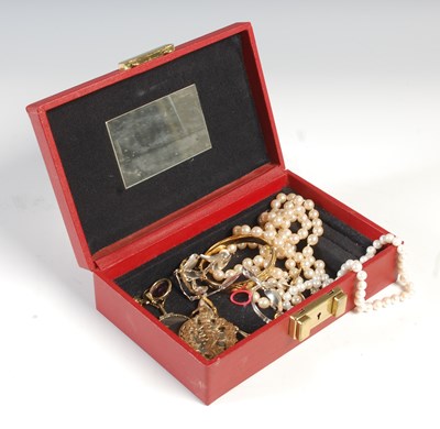 Lot 221 - A red coloured jewellery box containing...