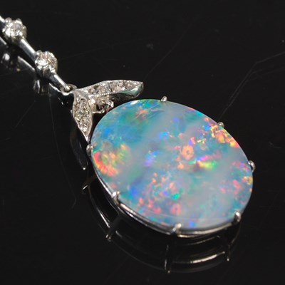 Lot 243 - A 9ct white gold black opal and diamond set...