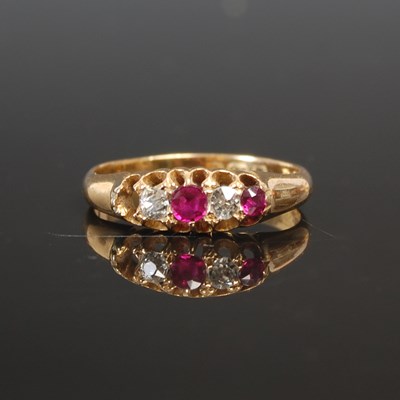 Lot 250 - An 18ct gold garnet and diamond set ring,...