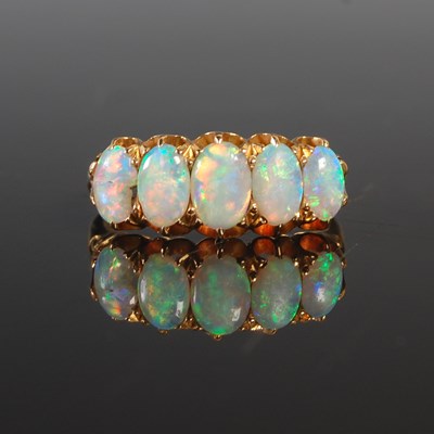 Lot 255 - An 18ct gold and opal five stone ring (one...