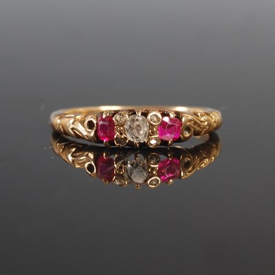 Lot 261 - A yellow metal garnet and diamond set ring,...