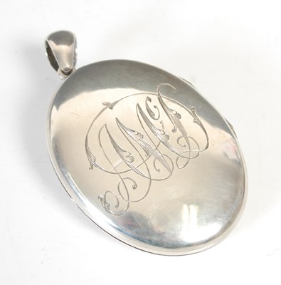 Lot 275 - A Victorian silver oval locket, inscribed 'A...