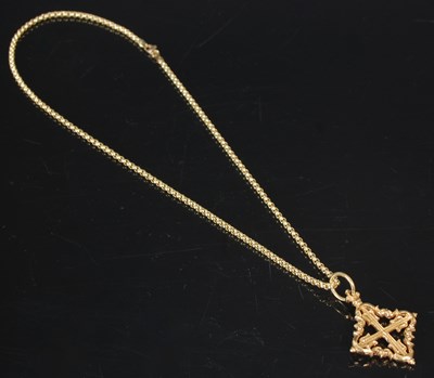 Lot 223 - A yellow metal Mallorcan cross pendant and...