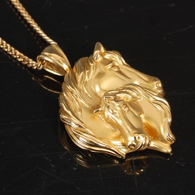 Lot 227 - An 18ct gold mare and foal double horse head...