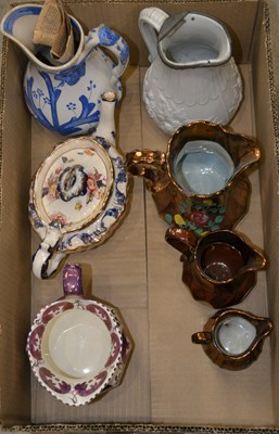 Lot 510 - A box of assorted English ceramic jugs, to...