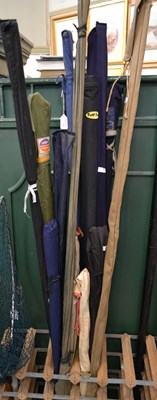Lot 514 - A group of assorted fishing rods, to include a...