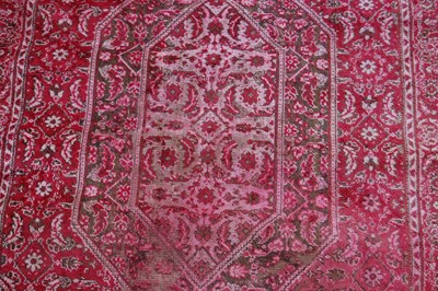 Lot 810 - A small prayer mat, 20th century, the madder...