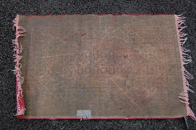 Lot 810 - A small prayer mat, 20th century, the madder...