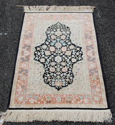 Lot 811 - A small Indian silk rug, 20th century, the...