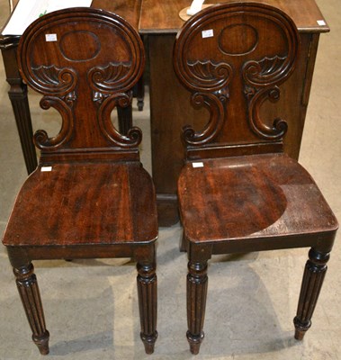 Lot 646 - A pair of 19th century mahogany hall chairs...