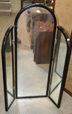 Lot 649 - A 20th century arched black floor mirror with...