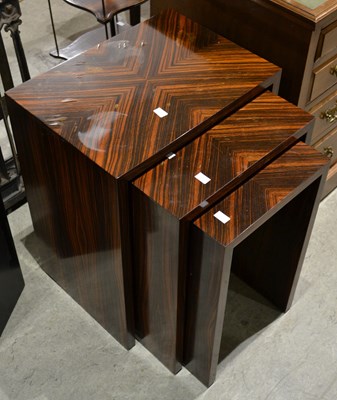 Lot 650 - A 20th century nest of three occasional tables...