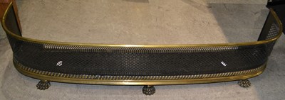 Lot 653 - A 19th century curved fireside fender, with a...