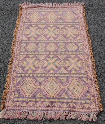 Lot 813 - A 20th century rug, the blue-purple ground...