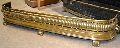 Lot 655 - A 19th century brass fire fender with pierced...