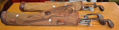 Lot 664 - Two vintage golf bags and clubs, to include...