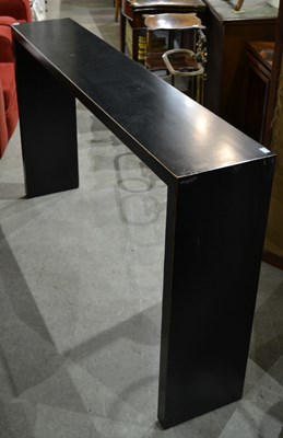 Lot 670 - A 20th century black lacquered console table...
