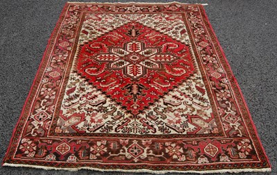 Lot 815 - A Persian rug, 20th century, the beige...