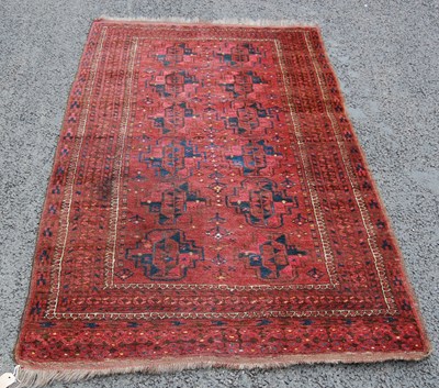 Lot 817 - A Persian rug, 20th century, the madder ground...