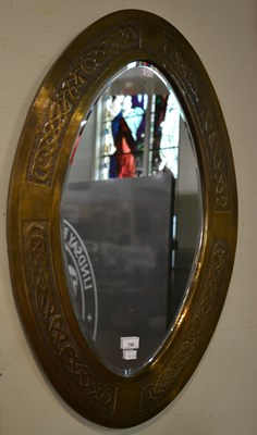Lot 745 - An early 20th century Arts & Crafts oval wall...