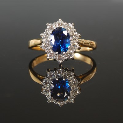 Lot 263A - An 18ct gold sapphire and diamond cluster ring,...