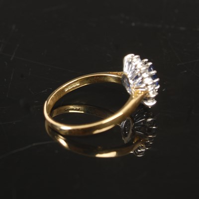 Lot 263 - An 18ct gold sapphire and diamond cluster ring,...