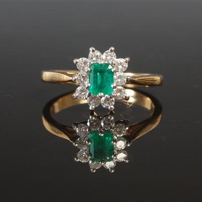 Lot 263B - An 18ct gold emerald and diamond cluster ring,...