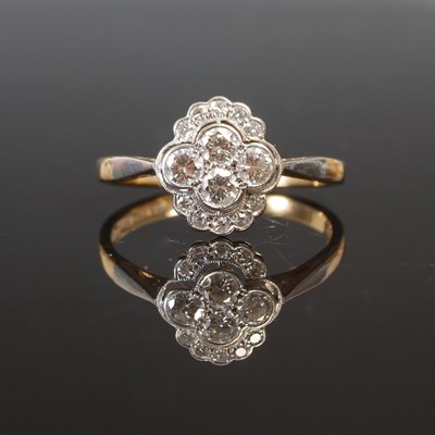 Lot 263E - A yellow and white metal diamond cluster ring,...