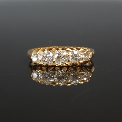 Lot 263G - A yellow metal and diamond five stone ring set...