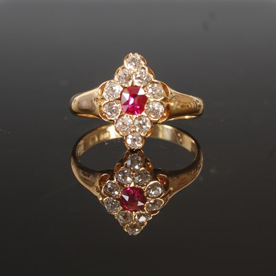 Lot 263H - An 18ct gold ruby and diamond set navette ring,...