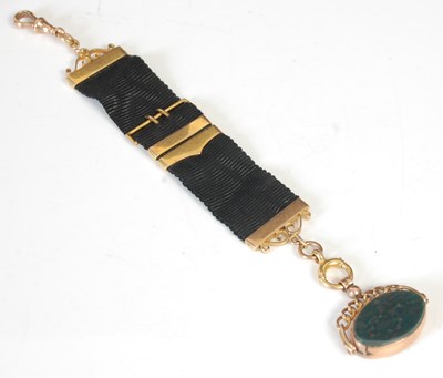 Lot 263T - A 9ct gold mounted bloodstone spinner fob...
