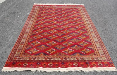 Lot 821 - A 20th century Tekke type rug, the madder...