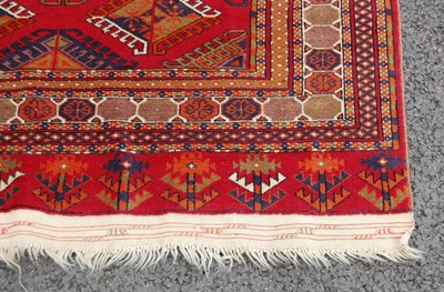 Lot 821 - A 20th century Tekke type rug, the madder...